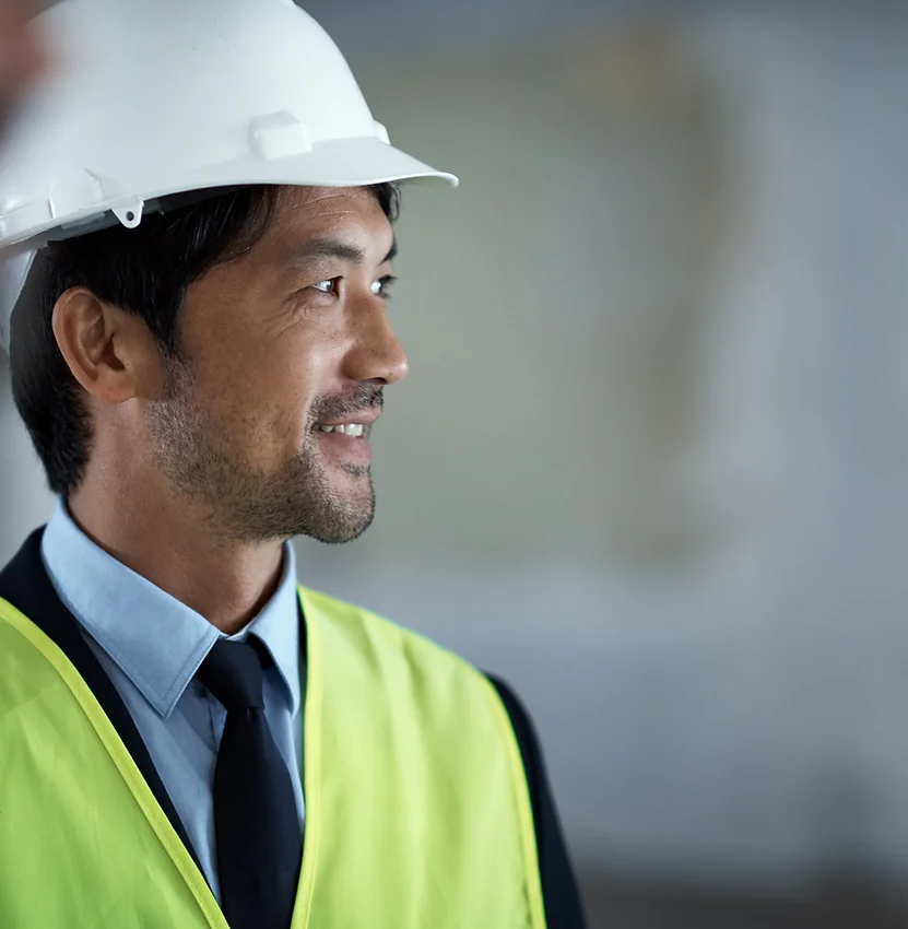 Man wearing safety vest and hard hat A man in a hard hat and vest.