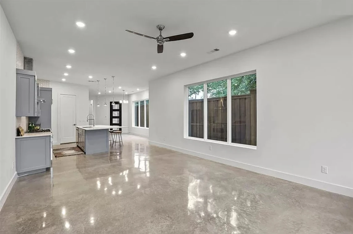 A large open floor plan with white walls and floors.