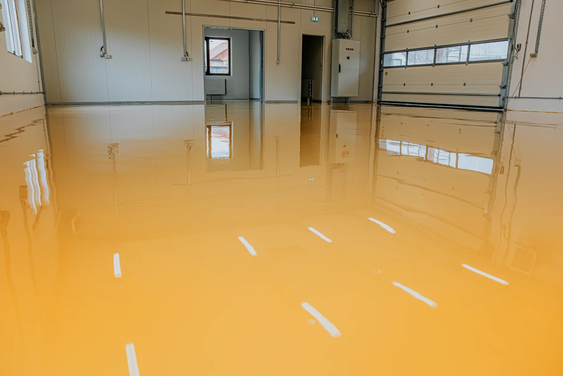 A garage floor that has been painted orange.