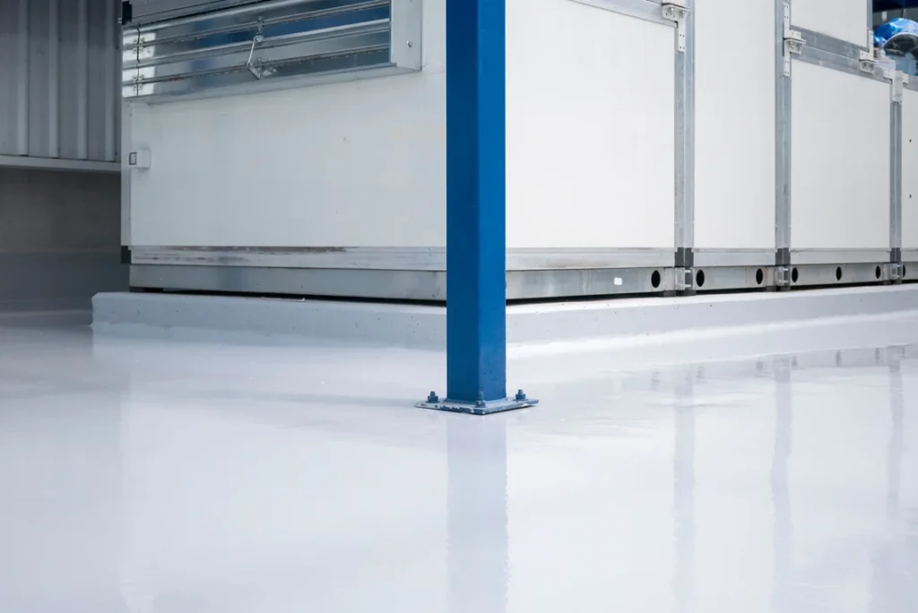 A blue pole in the middle of a white floor.