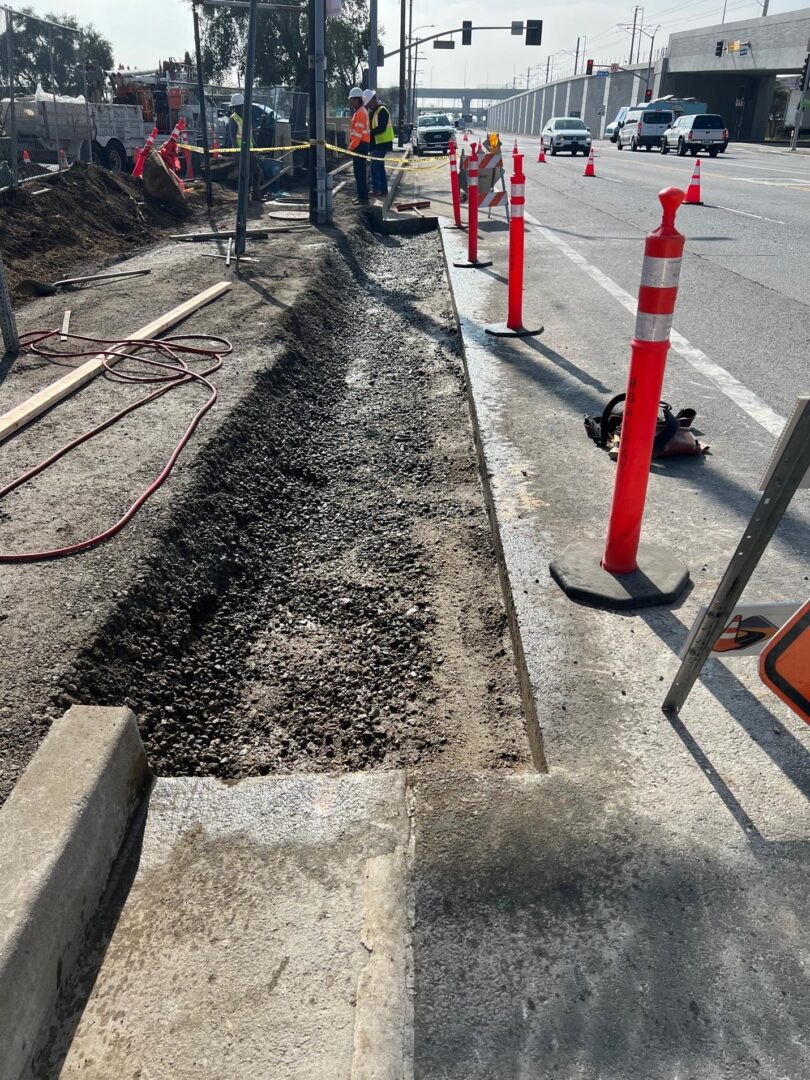 Road construction with cones and workers.