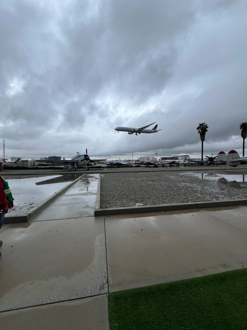 Airplane landing on a cloudy day.