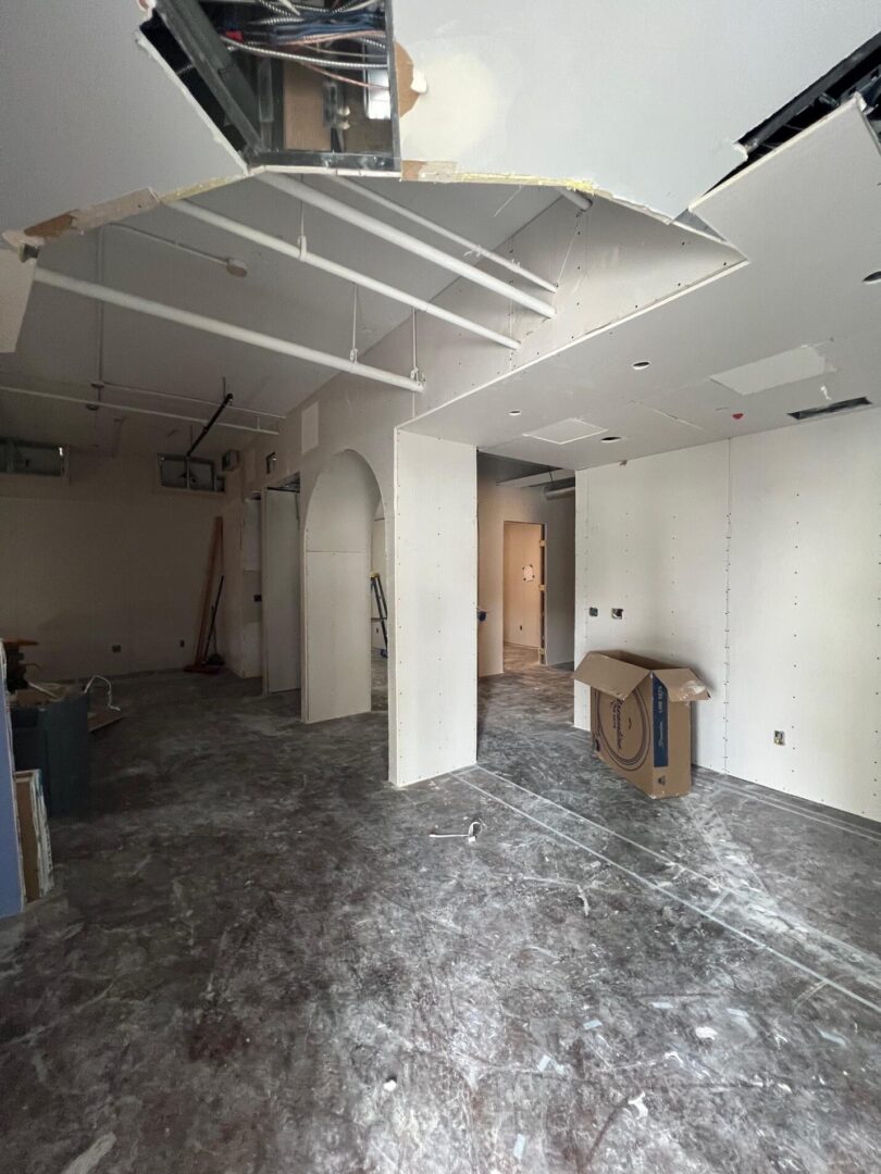 Empty room under construction with drywall.