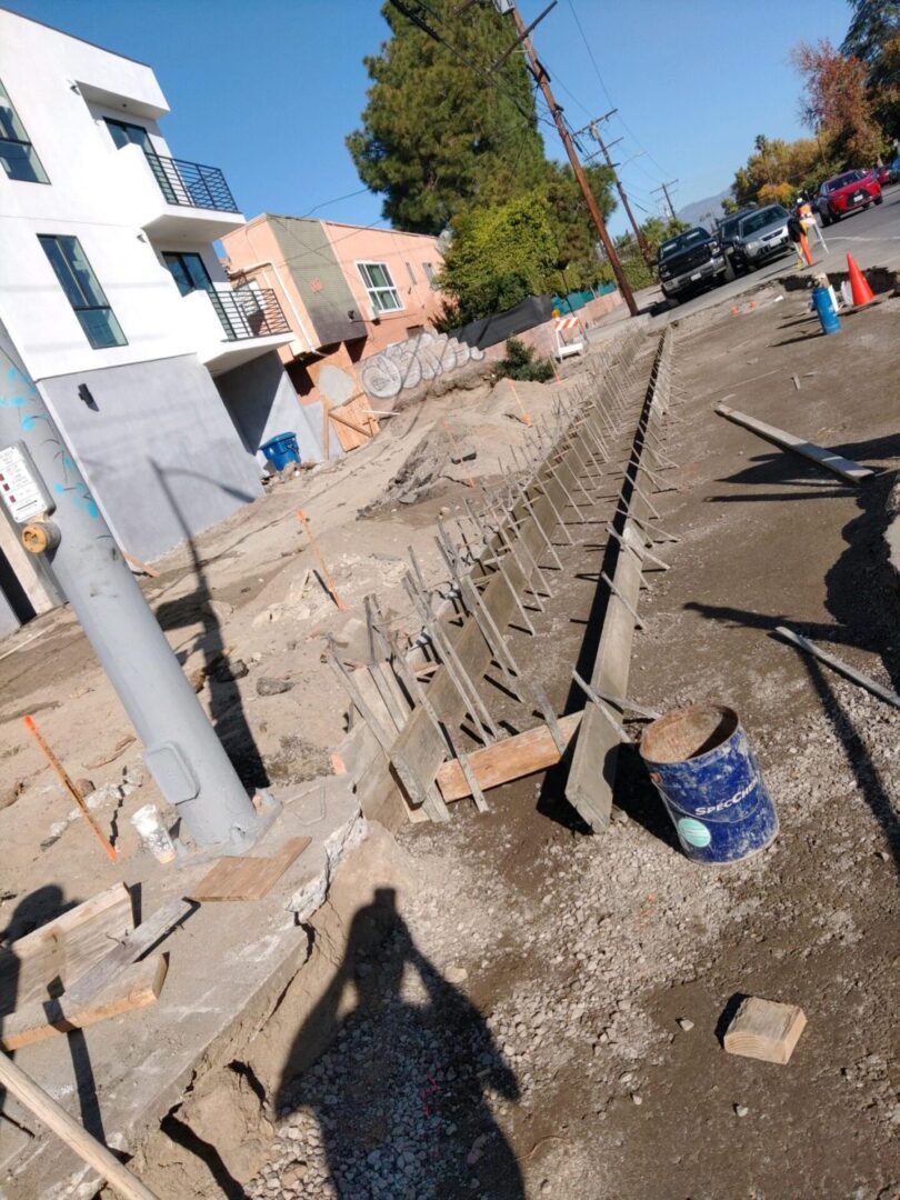 Construction site with metal supports and a bucket.