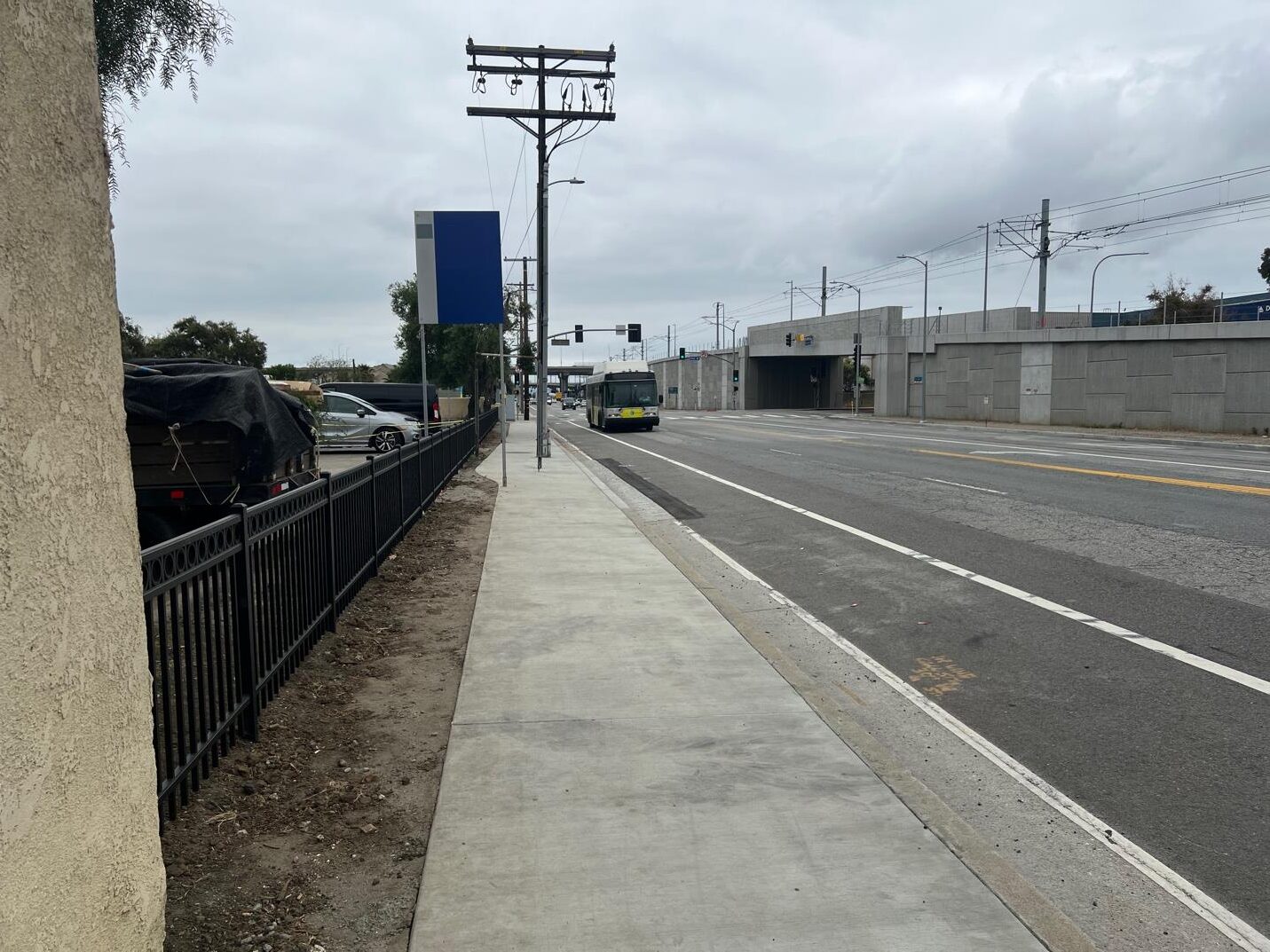 Bus stop with sidewalk and street.