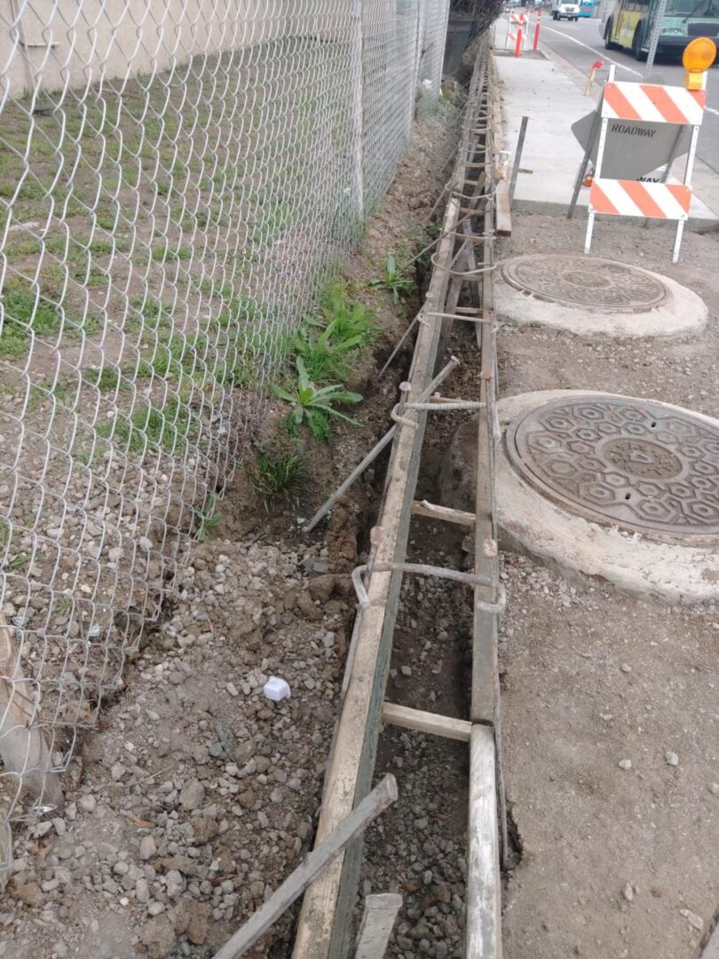 Construction site with wooden formwork and rebar.