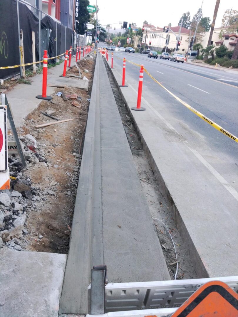 Freshly poured concrete sidewalk under construction.